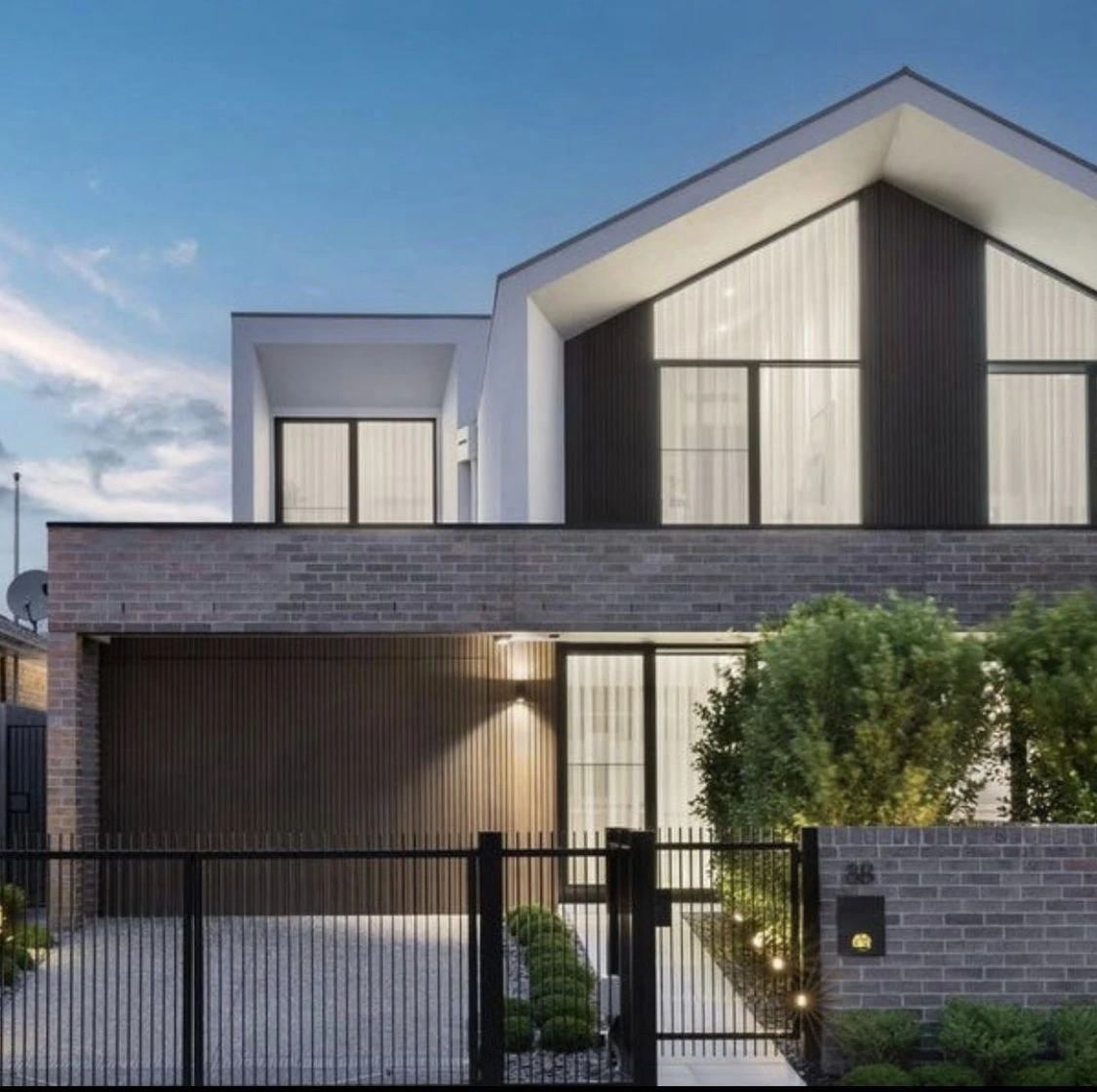 Contemporary two-storey home with light grey face brickwork and a pitched roof